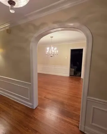After: arched doorway and trim in fresh white