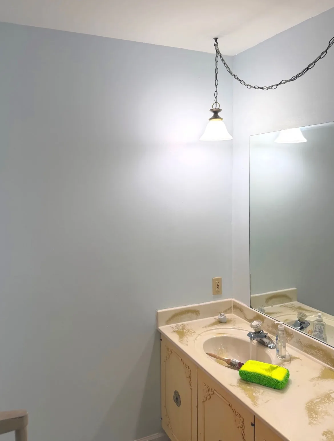 After: bathroom repainted in light blue
