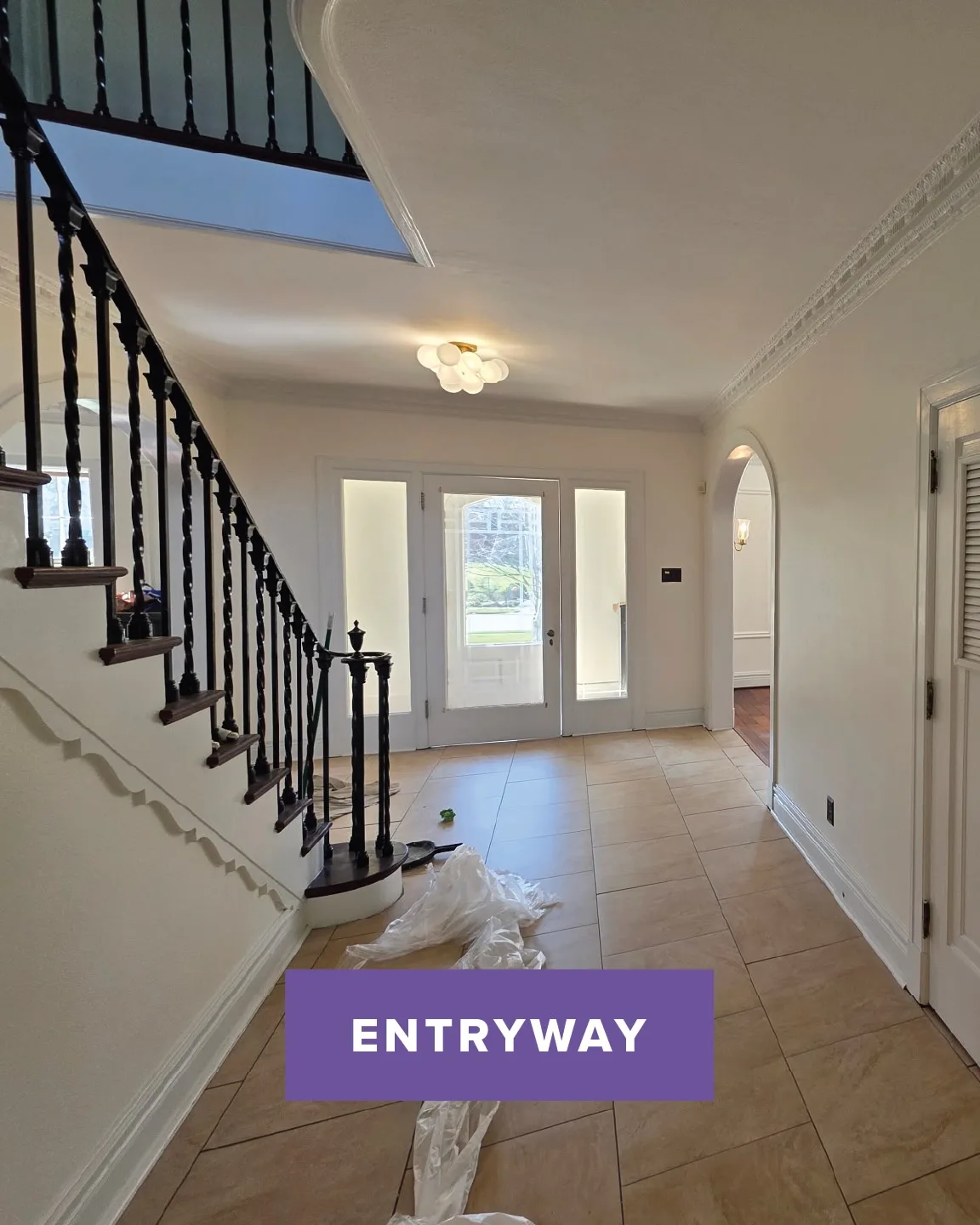 After: entryway and staircase in off-white