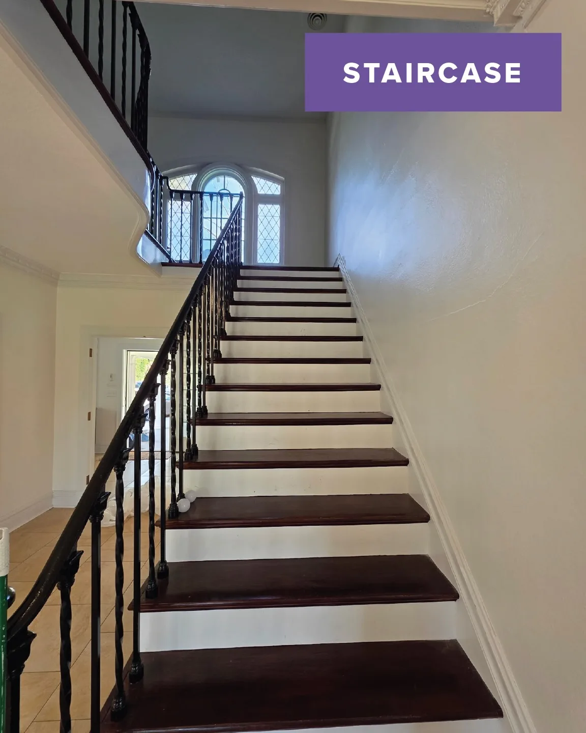 After: staircase with fresh white risers and trim